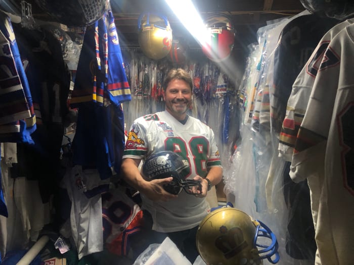 Chris Blaine poses with some of his World League memorabilia
